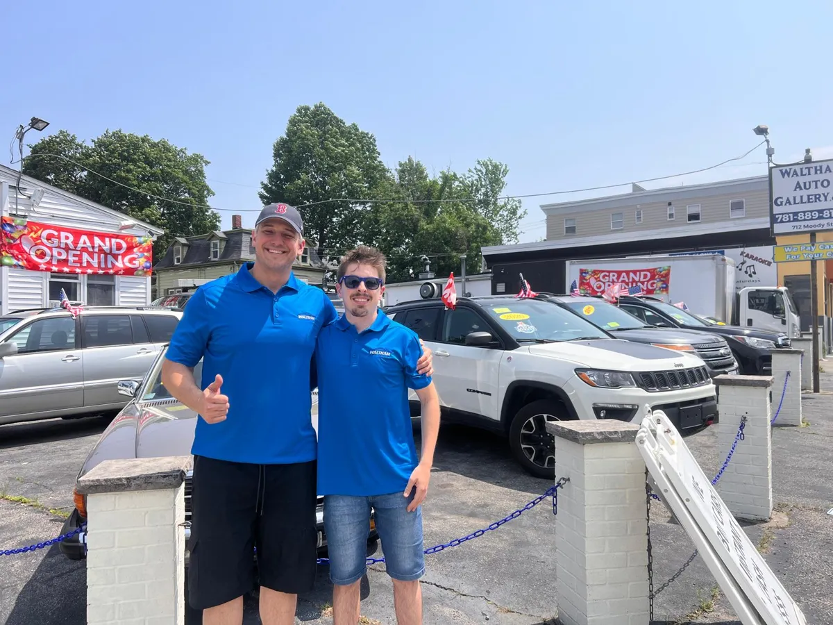 Cristiano and Kelvin, owners of Waltham Auto Gallery, on the lot at 712 Moody St